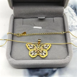 Close-up of S925 sterling silver butterfly pendant with hollow texture in jewelry box