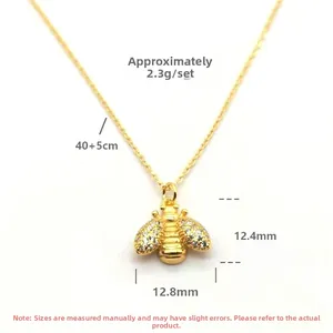 Detailed size view of a gold S925 silver bee pendant with cubic zirconia stones