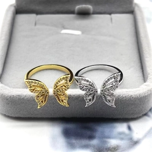 Close-up of gold and silver S925 sterling silver butterfly rings with pavé cubic zirconia
