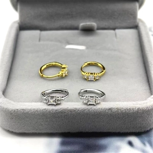 Detailed view of S925 sterling silver geometric hoop earrings with triple zircon accents