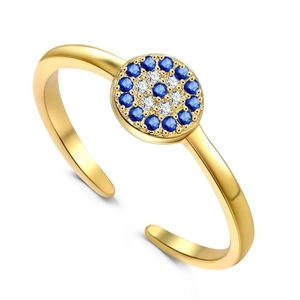 Macro detail of gold adjustable S925 silver evil eye ring with blue crystal pave stones
