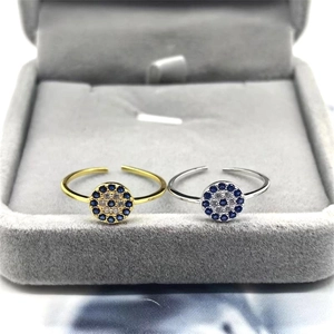 Detailed macro view of S925 sterling silver evil eye rings in gold and silver finishes