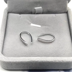 Minimalist S925 sterling silver U-shaped hook earrings displayed in a grey velvet box