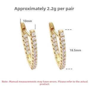 Detailed view of V-shaped gold earrings with zircon stones and 18.5mm height dimensions