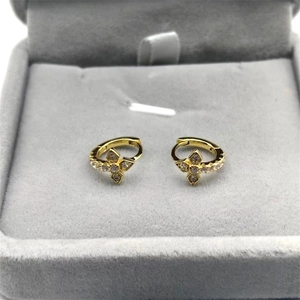 Elegant gold S925 silver hoop earrings with zircon studded flower charms in a jewelry box