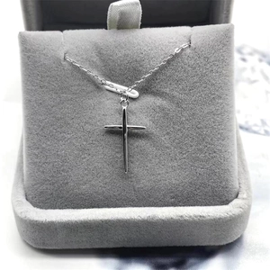 Minimalist S925 sterling silver cross pendant necklace in a grey velvet jewelry box