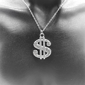 Macro detail of S925 sterling silver dollar sign pendant with sparkling pavé crystals