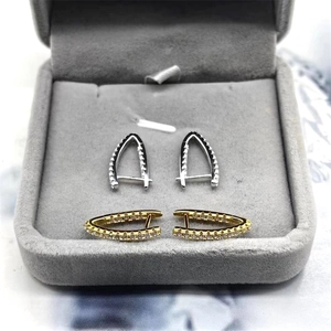 Detail of S925 sterling silver geometric V-shape hoop earrings with pavé zircon stones