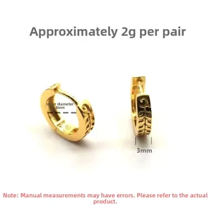 Macro detail of gold S925 sterling silver hoop earrings with engraved leaf pattern texture