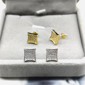 Macro shot of square micro-pave zirconia stud earrings in gold and silver plating