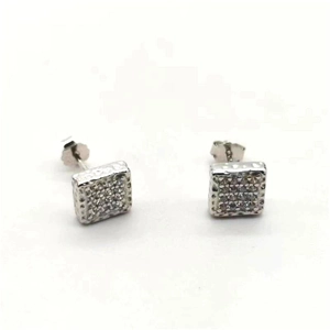 Macro shot of square S925 sterling silver stud earrings with pavé cubic zirconia