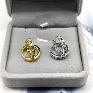 Detail of S925 sterling silver hoop earrings with green and white zircon in velvet box