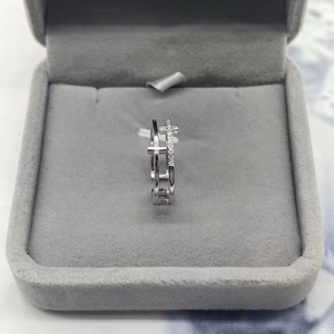 Double-layered S925 sterling silver ring with sparkling cross charms on velvet display