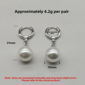 Detail view of S925 silver pearl drop earrings with 10mm white shell pearl and 31mm length