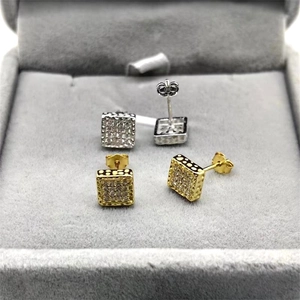 Detail view of square S925 silver stud earrings with zircon inlay in gold and silver set