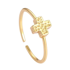 Close-up of golden S925 sterling silver open ring with textured cross design