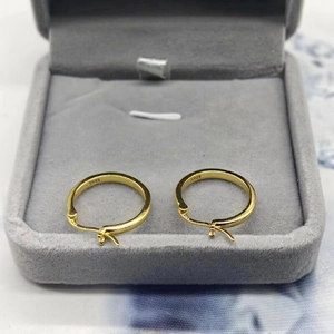 Elegant S925 sterling silver gold hoop earrings displayed in a luxury grey velvet jewelry box