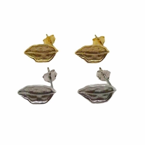 Detail of 925 sterling silver lip studs in gold and silver with textured stripes