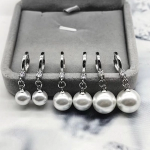 Detailed view of S925 silver pearl earrings with zircon in three gradient sizes