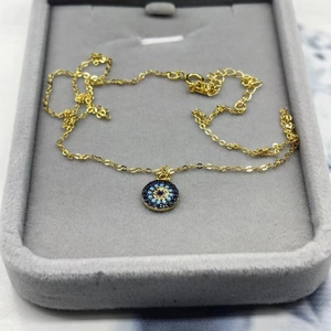 Minimalist S925 sterling silver evil eye pendant necklace with blue crystals on jewelry box
