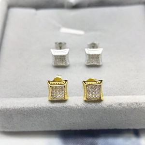 Macro detail of square micro-pave zircon stud earring sets in gold and silver finish