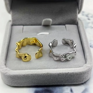 Close-up of irregular hammered texture S925 silver rings in gold and silver finish
