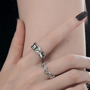 Detailed close-up of S925 sterling silver irregular hammered texture rings on fingers