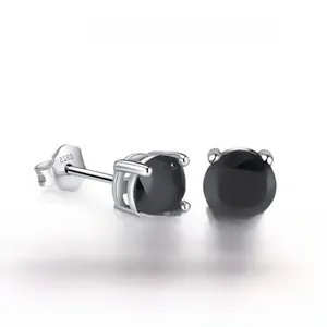 Macro shot of S925 sterling silver studs with black zircon in four-prong setting