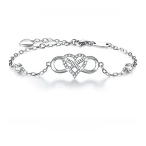 Detailed macro of 925 silver infinity heart bracelet featuring pavé set white zircons