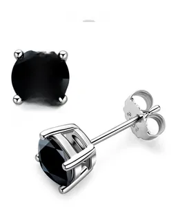 Macro view of S925 sterling silver four-prong earrings with round black cubic zirconia