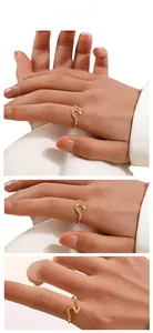 Three-way view of a minimalist wavy gold ring with elegant irregular curves for women