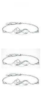 Detail of silver infinity heart bracelet featuring crystal accents and dangling charm