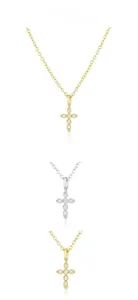 Macro detail of gold and silver S925 sterling silver cross necklaces with inlaid diamonds