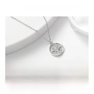 Detailed close-up of S925 silver compass necklace featuring an eight-pointed star pendant