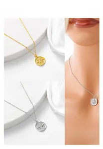 Detail of S925 sterling silver double-sided compass star pendant necklace in gold and silver