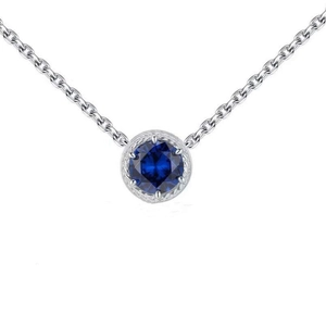 Close-up of a 925 sterling silver necklace featuring a dark blue zircon pendant set in silver