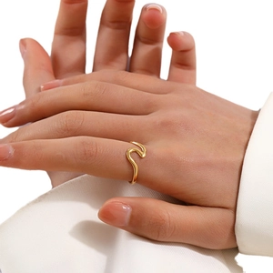 Minimalist wavy open 925 silver ring in gold finish shown on model hand