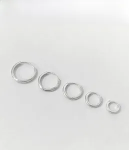 Detailed view of set of 5 graduated S925 sterling silver hoop earrings with high polish