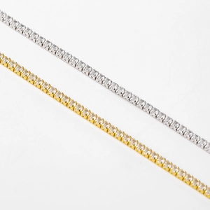 Close-up of gold and silver 925 sterling silver tennis chains with 4-prong zircon setting
