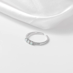 Polished S925 silver adjustable open ring featuring three white opals and sparkling accents