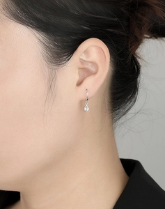 Close-up of 925 sterling silver teardrop earrings with sparkling cubic zirconia inlay