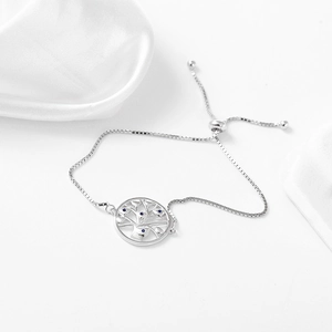 Detailed view of Tree of Life silver bracelet with blue gems and adjustable slider clasp