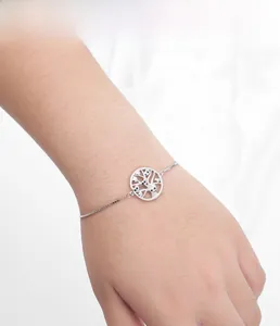 Detail of 925 silver tree of life bracelet with blue stones on an adjustable box chain