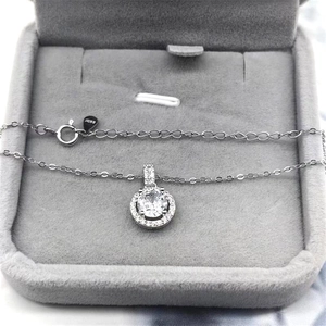 Macro shot of S925 sterling silver stamp on clasp and round pendant necklace detail