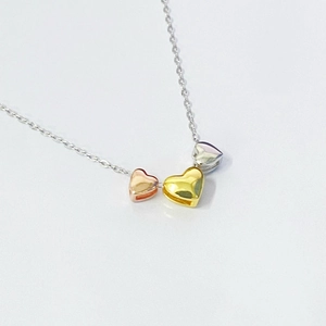 Three-tone heart pendant necklace in rose, gold and silver finish with fine chain