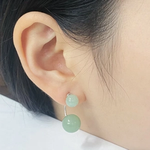 S925 sterling silver stud earrings featuring green aventurine double beads on a model