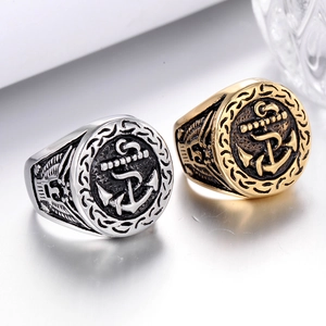 Vintage stainless steel anchor rings in silver and gold with embossed nautical details
