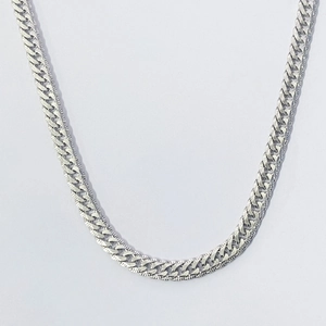 Polished S925 sterling silver curb chain necklace with textured links on white background