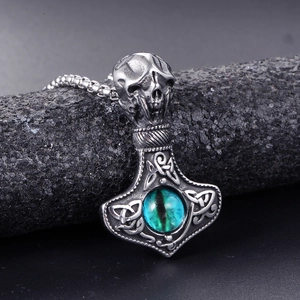 Gothic Thor's hammer necklace in vintage steel with skull detail and green gemstone eye
