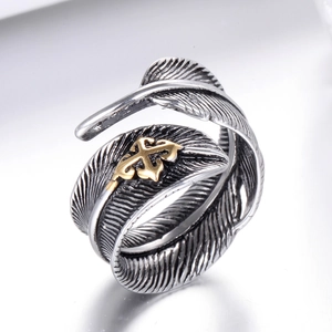 Vintage adjustable feather ring in silver and gold steel with intricate textures